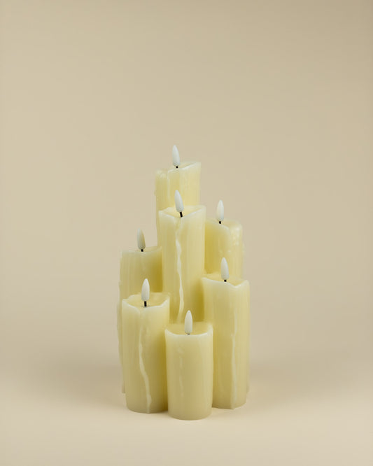 Candela LED a 7 fiamme in cera